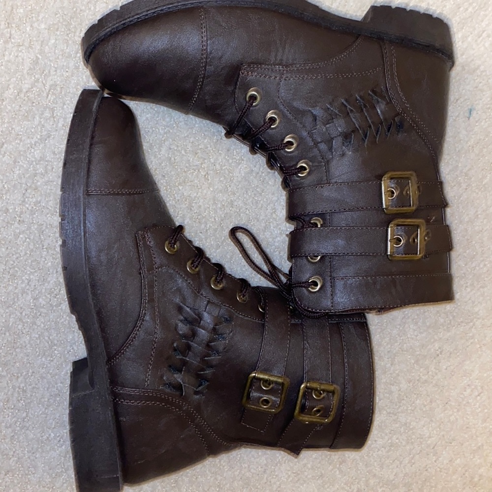 Brand is wanted. Size 9 in womens. Lace up leather brown boots with buckles